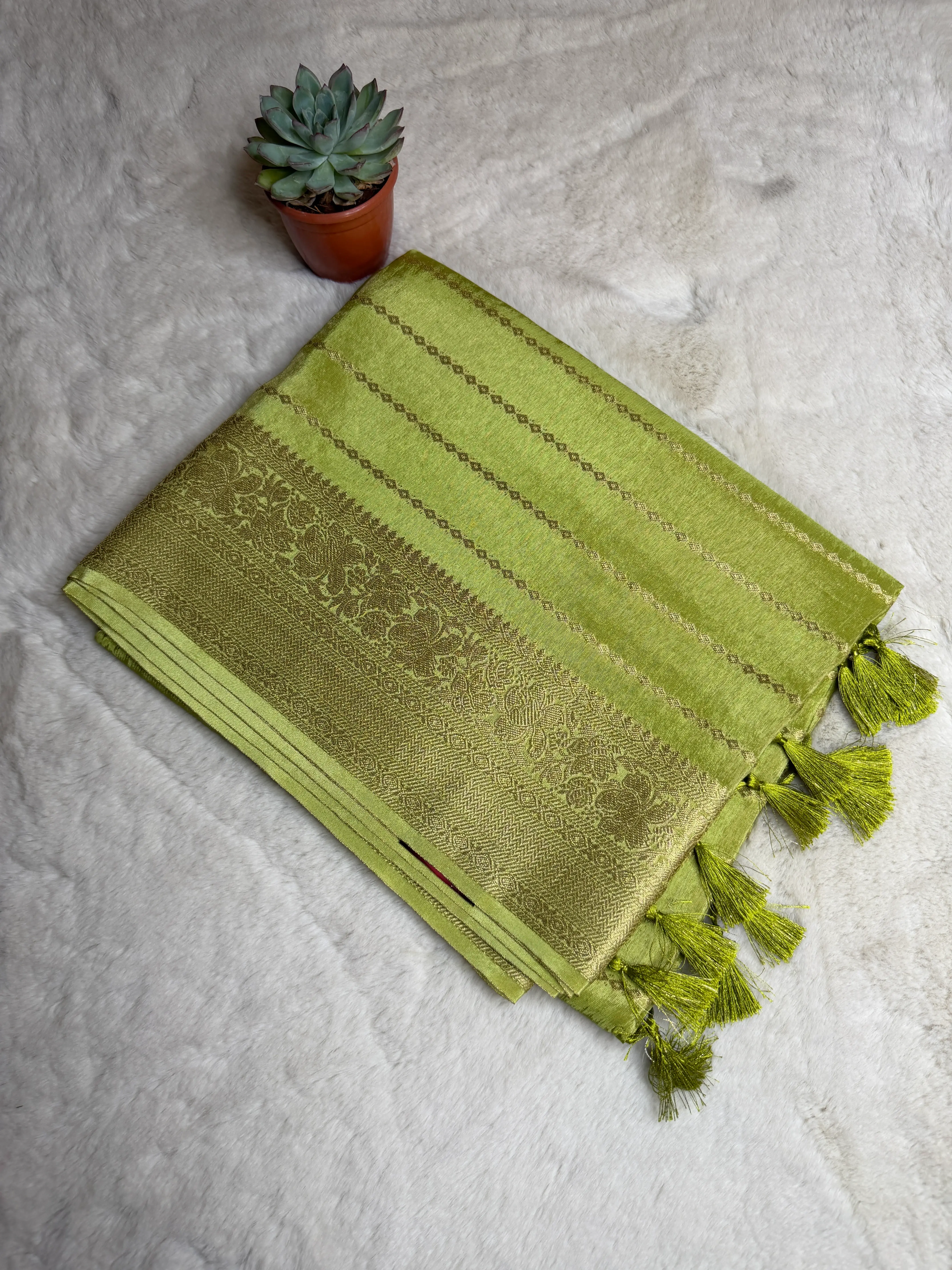 Stripes all over the body with rich border & pallu Semi Crepe Saree