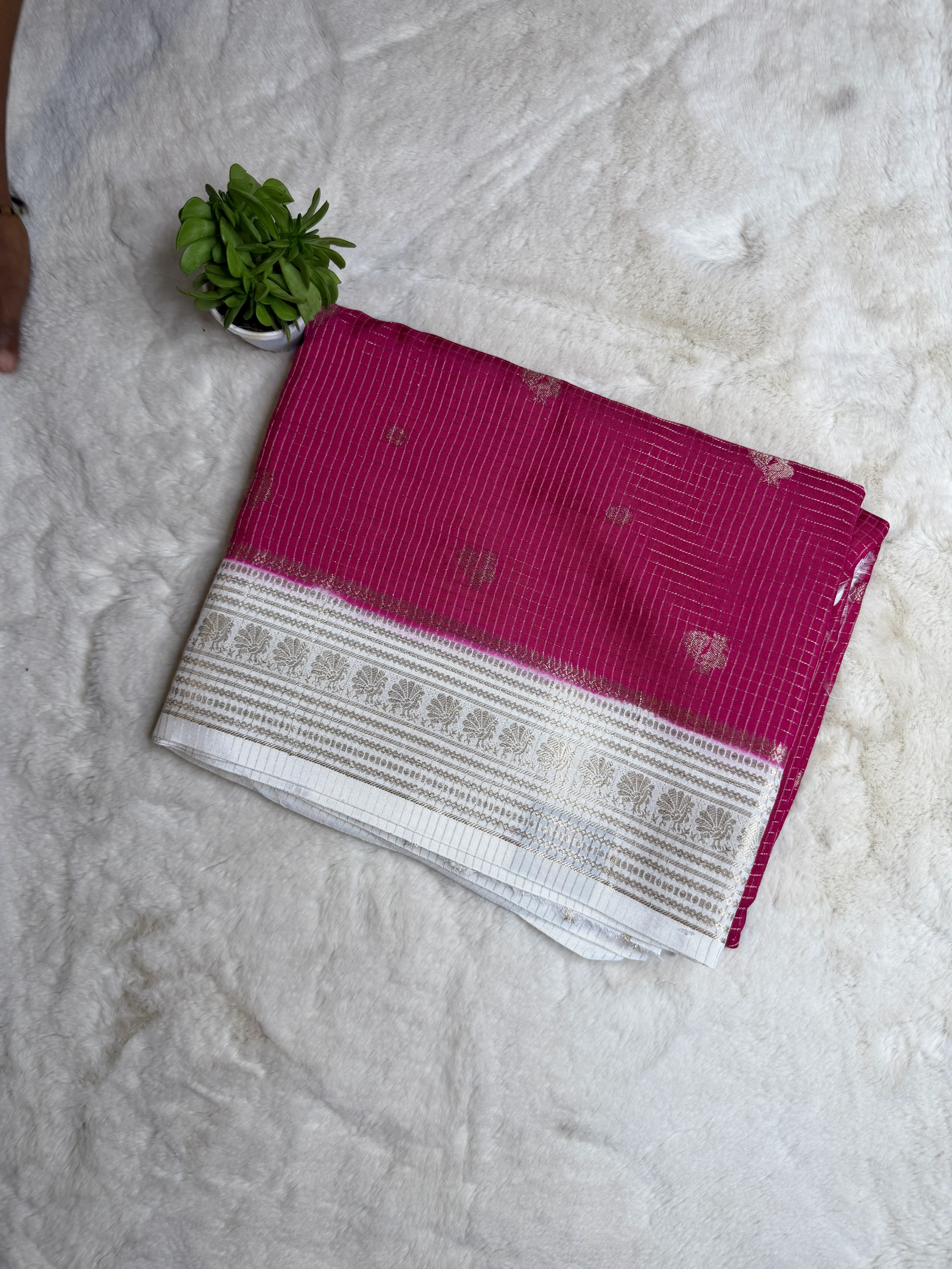 Red with Cream Microchecks all over the body with peacock motifs semi crepe saree