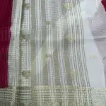 Red with Cream Microchecks all over the body with peacock motifs semi crepe saree