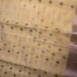 Lemon yellow with buttas chiffon saree