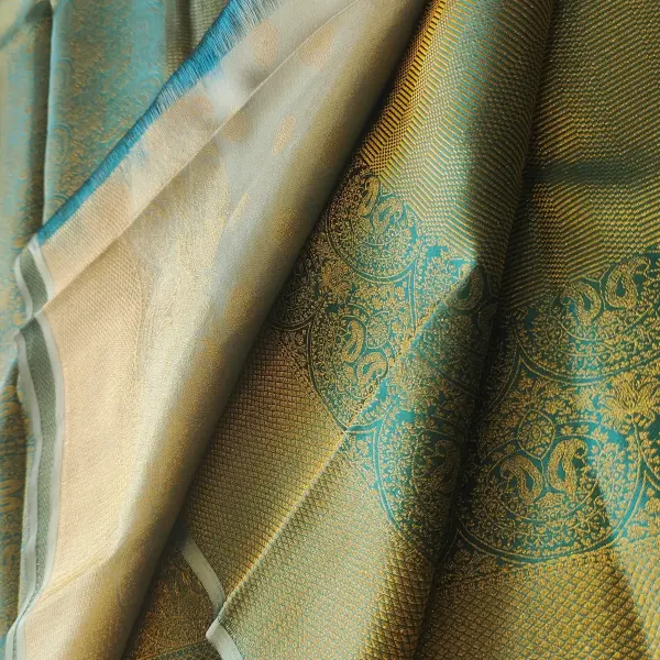 Dark green all over zari body with contemporary border silk sarees