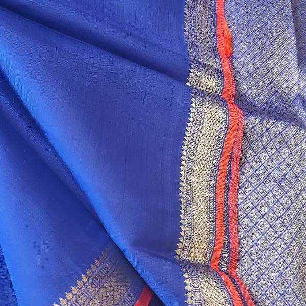 Royal blue small buttis with orange border pure silk saree