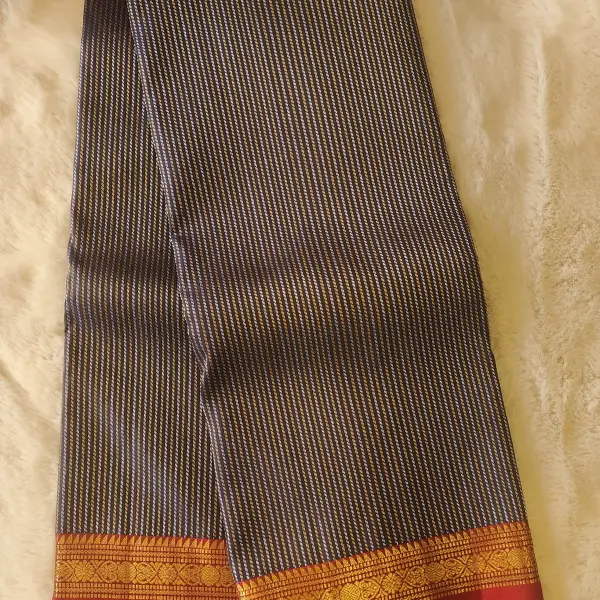 Navy blue with gold and silver verticle lines red border pure silk saree