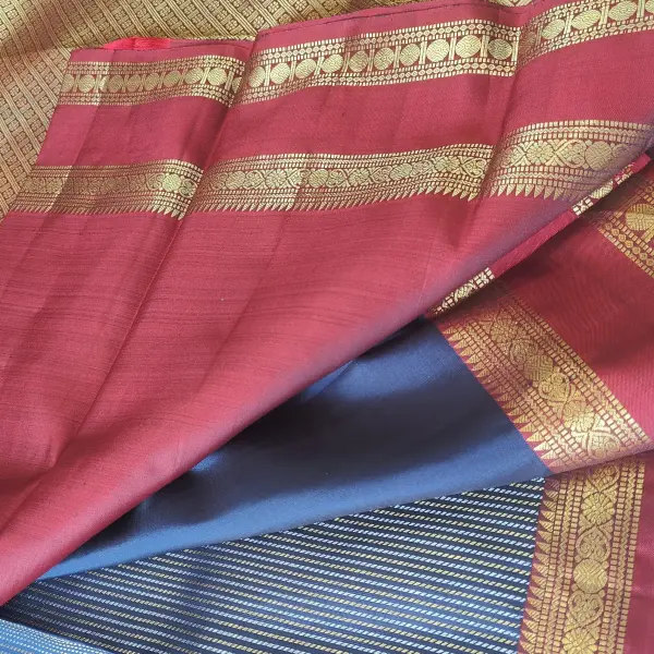 Navy blue with gold and silver verticle lines red border pure silk saree