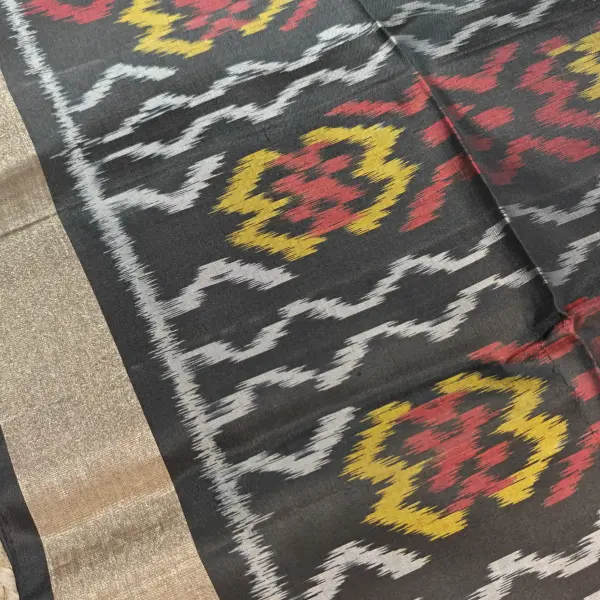 Yellow and black Ikkat pattern soft silk saree