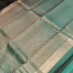 Black and teal blue small motifs silk saree