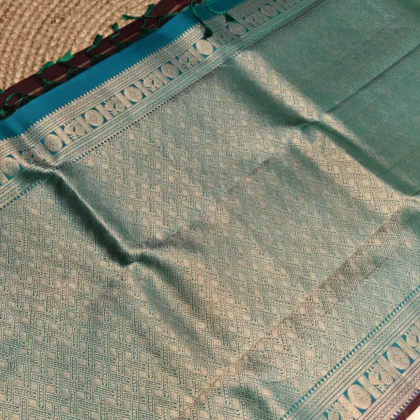 Brown checks with blue contrast peacock border silk saree