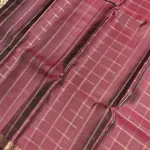 Brown checks with blue contrast peacock border silk saree