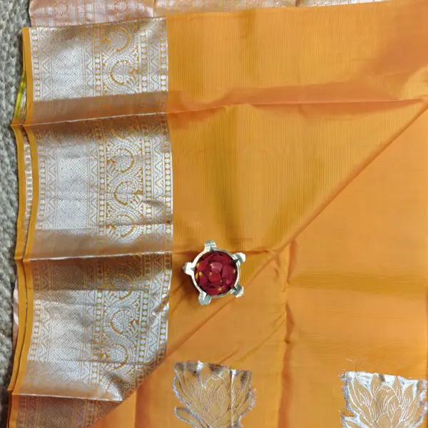 Yellow with silver flower border silk saree